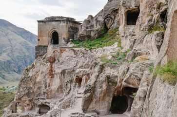 Naklejka premium View of Vardzia caves. Vardzia is a cave monastery site in southern Georgia, excavated from the slopes of the Erusheti Mountain on the left bank of the Kura River. Travel for tourists