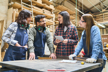 Teamwork and collaboration in a busy lumberyard workshop