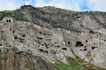 View of Vardzia caves. Vardzia is a cave monastery site in southern Georgia, excavated from the slopes of the Erusheti Mountain on the left bank of the Kura River. Travel for tourists