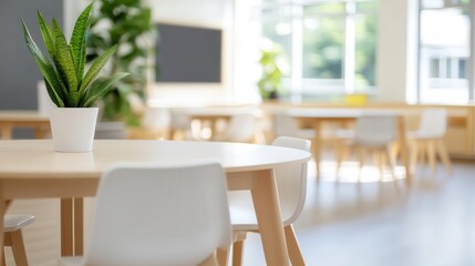 A modern schoolroom featuring collaborative workstations, blurred in the background as students engage in group projects.