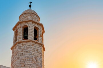 Fototapeta premium White church bell tower with a cross at sunset, evoking peace, faith, and historical architecture.