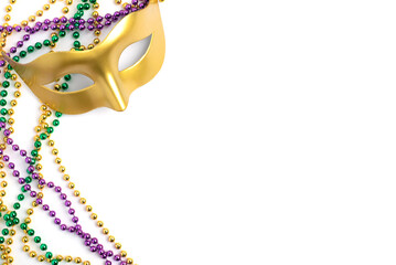 Mardi Gras beads and mask isolated on white background © Anna