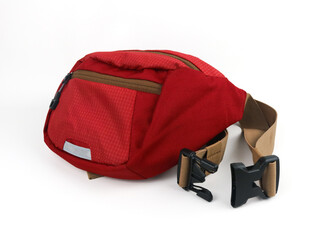 Bright sports burgundy waist bag on a white background.