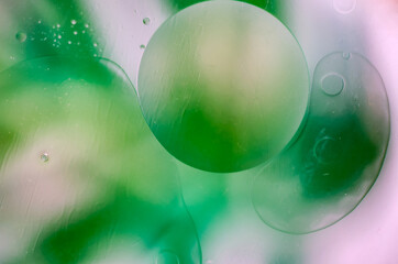 Abstract background with translucent green oil bubbles and smooth gradients. Ideal for eco-friendly concepts, design projects, and modern visuals.


