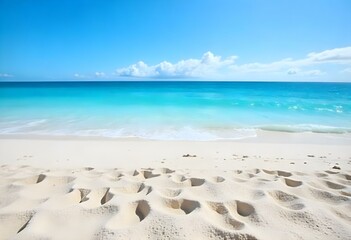 A tropical beach with white sand and clear turquoise water under a blue sky with wispy clouds