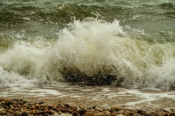 Ocean wave crashing on a pebble beach.