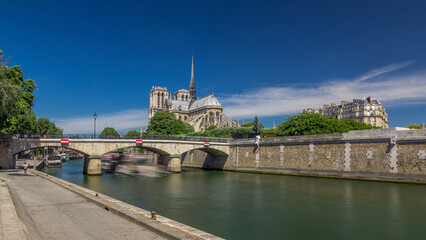 Fototapeta premium Seine and Notre Dame de Paris timelapse hyperlapse is the one of the most famous symbols of Paris