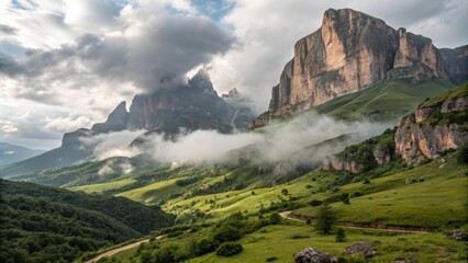 Sunlight filters through the clouds, illuminating towering peaks and rolling green hills in ingushetia, russia, creating a breathtaking scene of natural beauty