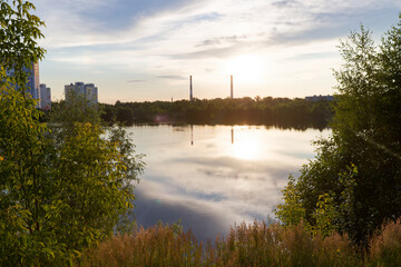 Fototapeta premium A beautiful lake with a reflection of the sun in the water. Nizhny Novgorod. Russia