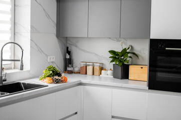 Fresh vegetables and fruits in a reusable bag in the modern kitchen. Concept of healthy eating and organic food. Grocery shopping. Zero Waste. Eco-Friendly Shopping. The idea of a healthy lifestyle