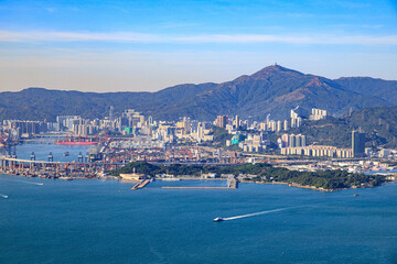 Scenic Coastal View of Hong Kong Cityscape and Mountains