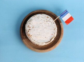 bowl of camembert cheese on light background