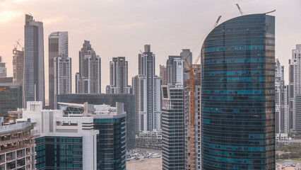 Obraz premium Dubai business bay towers at sunset aerial timelapse.