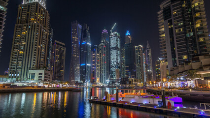 Dubai marina bay with yachts an boats night timelapse hyperlapse