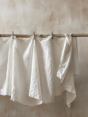Fototapeta premium Freshly washed linen draped elegantly on a clothesline in soft evening light by a rustic wall. Generative AI