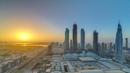 Dubai downtown with sunrise timelapse. Top view from above