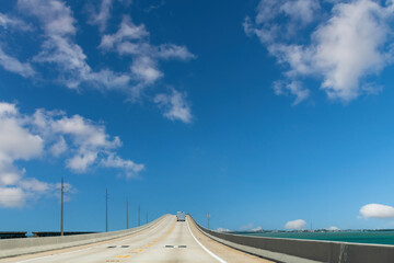 Drivers’ perspective over the Seven Mile Bridge or Florida State Road A1A towards Key West, FL,...