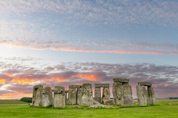 Sunset clouds at Stonehenge prehistoric structure on Salisbury Plain, Wiltshire, England consisting...