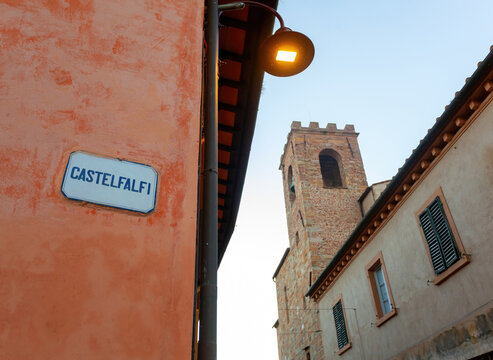 Fototapeta Castelfalfi street sign with medieval tower in tuscany, italy