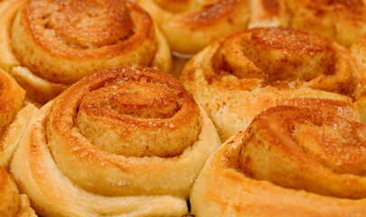 freshly made tray of cinnamon rolls, macro food background