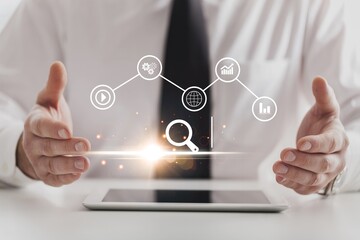 Businessman hold SEO icon at virtual screen