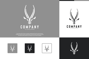 minimalist antelope head horns, vintage style, graphic design inspiration. © dhulpikir