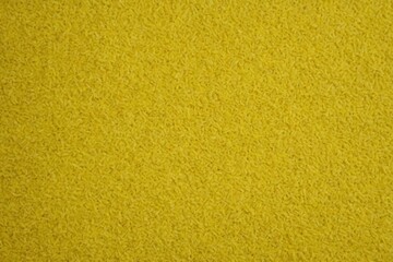 Fototapeta premium lemonchiffon color rough textured background with copy space, background for wallpaper, minimal flat lay.