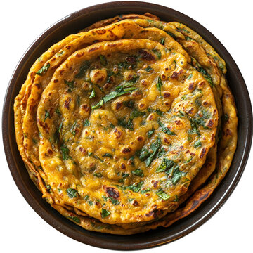 Extreme top view of an extremely perfect looking methi thepla in a dark porcelain bowl isolated on a white transparent background