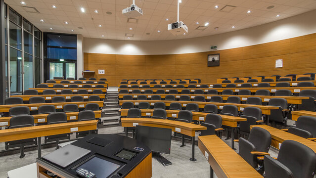 A wood panelled university lecture theatre or conference hall in business school timelapse.