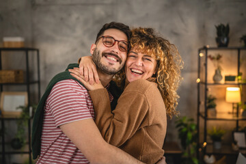 Fototapeta premium Portrait of couple girlfriend and boyfriend in love hug at home