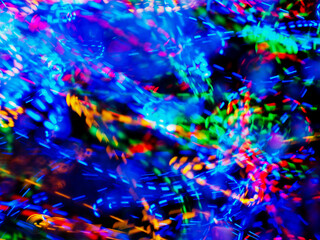 A colorful, blurry background with a rainbow of colors. The colors are bright and vibrant, creating a sense of energy and excitement. Abstract design wall paper. Cinematic light effect.