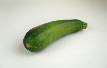 Fresh green zucchini isolated on white background