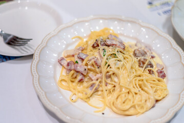 Creamy Carbonara Pasta with Pancetta on Elegant White Plate