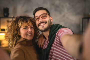 Self portrait of couple girlfriend and boyfriend in love hug at home