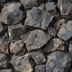 Fototapeta premium Close-up of a rugged stone wall showcasing rough, textured natural rocks layered together.