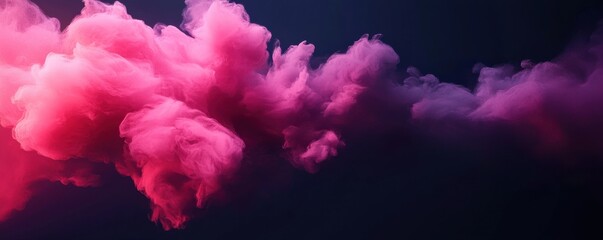 Fototapeta premium A vibrant pink cloud of smoke swirls against a dark background, creating an artistic and ethereal atmosphere.