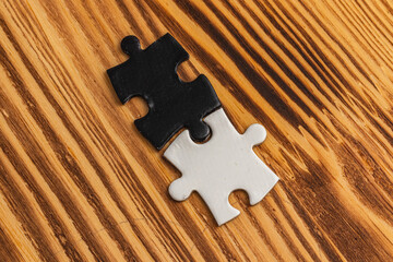 A black and white puzzle piece fit for a concept of yin yang or opposites