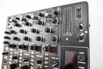 Close-Up Shot of an Audio Mixer With Various Control Knobs and Settings