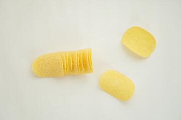 Crispy potato chips isolated on white background