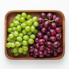 Fresh green and red grapes beautifully arranged in a wooden bowl, showcasing their vibrant colors and natural texture.