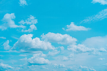 Serene Blue Sky Filled With Fluffy White Clouds on a Sunny Day