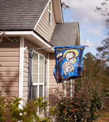 Religious banner depicting Joseph, Mary and Baby Jesus, representing the Birth of Jesus and...
