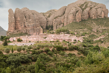 Serenity in Stone: Aguero's Village Amidst Towering Rock Giants