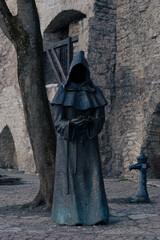 Monk statue in the old town of Tallinn (Estonia)