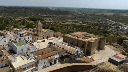 Obraz premium Aerial view of the church of San Bernardino da Siena and the castle located in the historic center of the town of Bernalda, in the province of Matera, Basilicata, Italy.