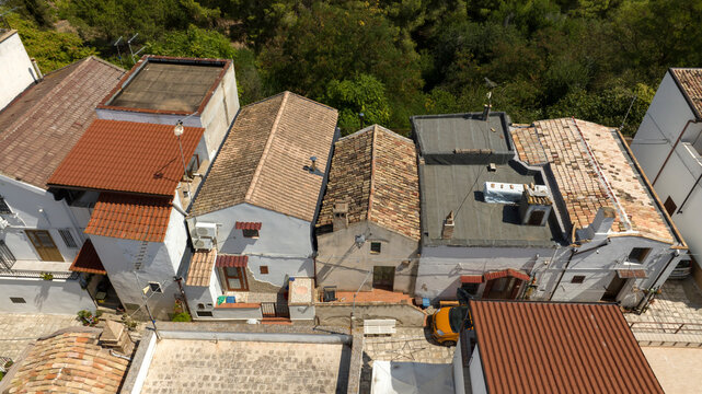 Aerial view of houses, apartments and buildings located in the historic center of the town of Bernalda, in the province of Matera, Basilicata, Italy. It is a traditional Italian village.
