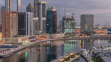 Naklejka premium The rhythm of the city of Dubai from night to morning aerial timelapse