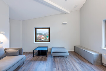 Cozy Modern Home Living Room Interior with Large Windows and Comfortable Furniture