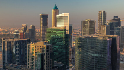 Obraz premium Dubai's business bay towers at morning aerial timelapse.