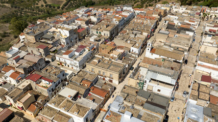 Fototapeta premium Aerial view of houses, apartments and buildings located in the historic center of the town of Bernalda, in the province of Matera, Basilicata, Italy. It is a traditional Italian village.